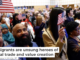 Carmindo Alves Barbosa Amado, originally of Cape Verde, waves the American flag after being sworn in during a naturalization ceremony in Boston in April 2024. Danielle Parhizkaran/The Boston Globe via Getty Images